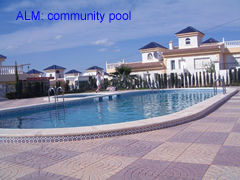ALM 037 community swimming pool of this 2 bedroom villa at la marquesa golf course, ciudad quesada, costa blanca, spain