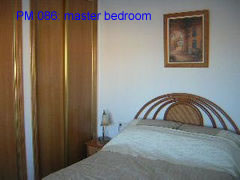 PM 086 master bedroom of this 2 bedroom villa near la marquesa golf course, ciudad quesada, costa blanca, spain 